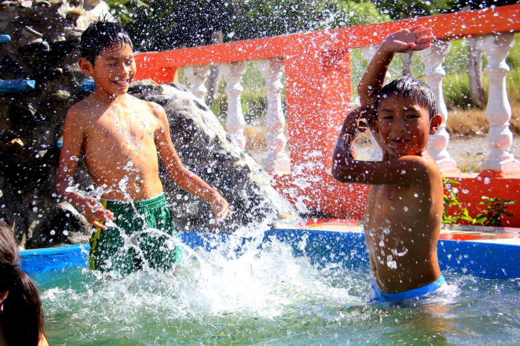 Carlos's boys enjoy the pool - Imbaburra, Ecuador